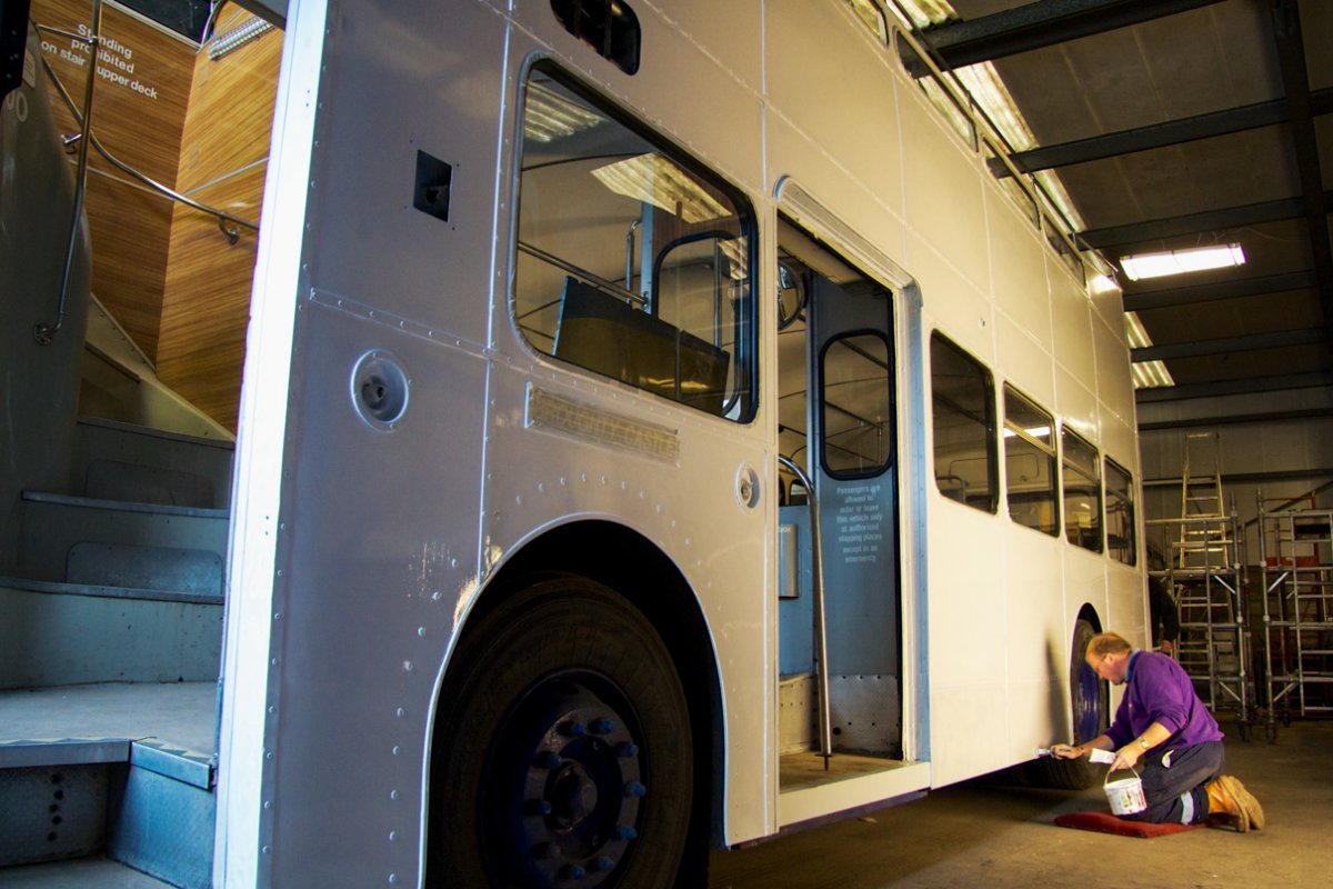 Hand painting a bus