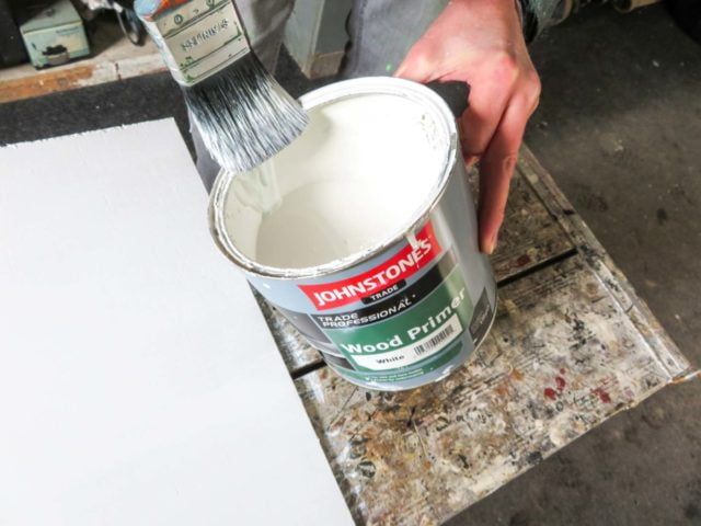 Wiping excess paint from a brush