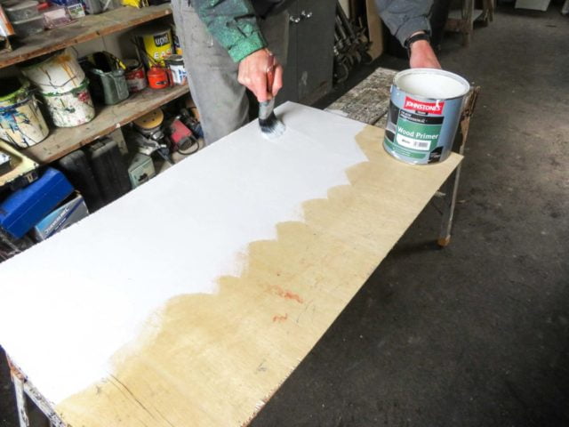 Brushing paint on by hand