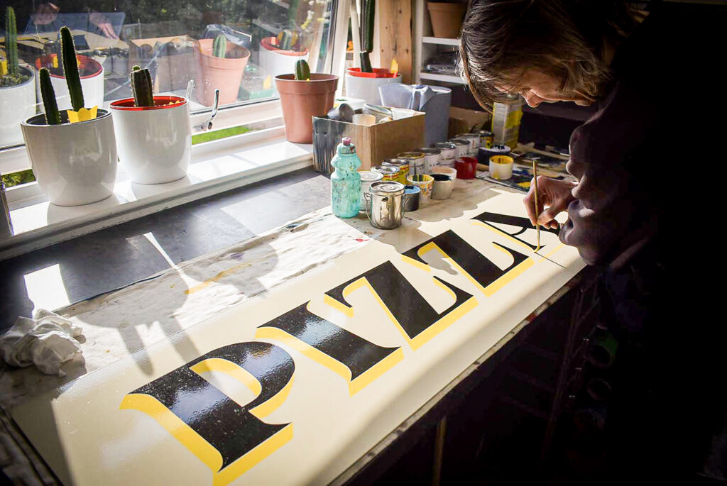 Robertsign Signwriting Pizza sign inside studio