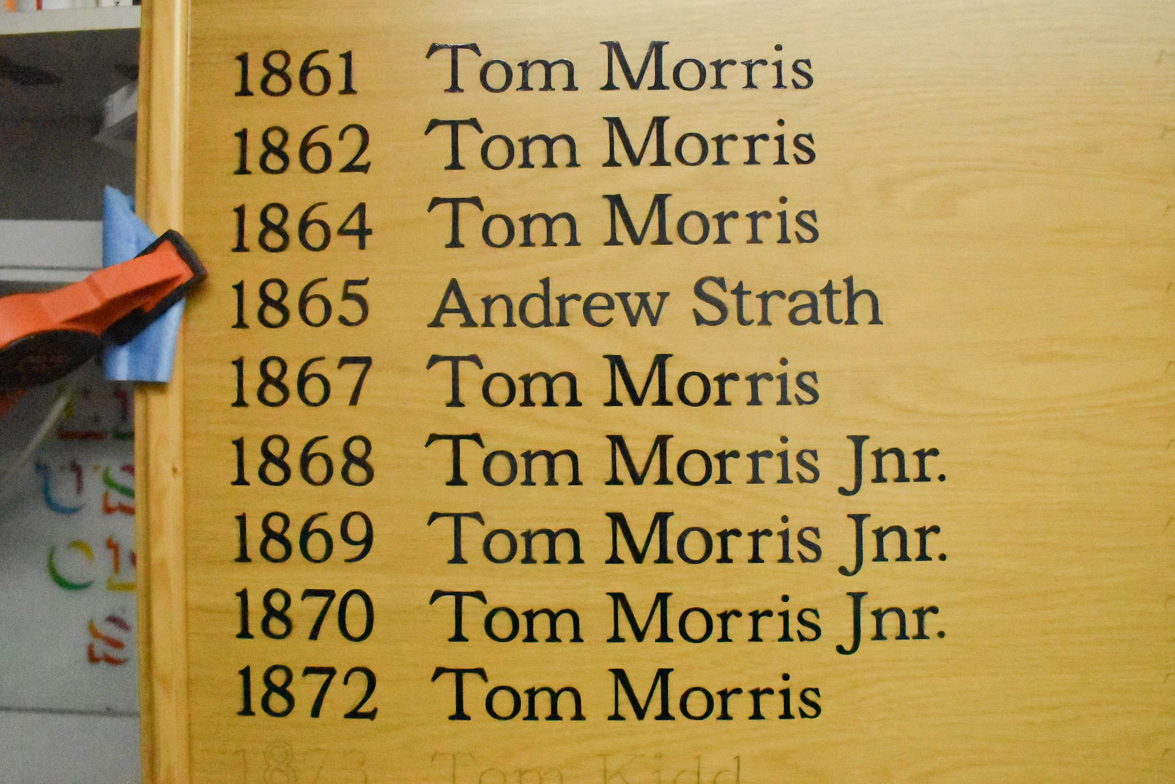 Signwriting Tom Morris multiple times on an honours board