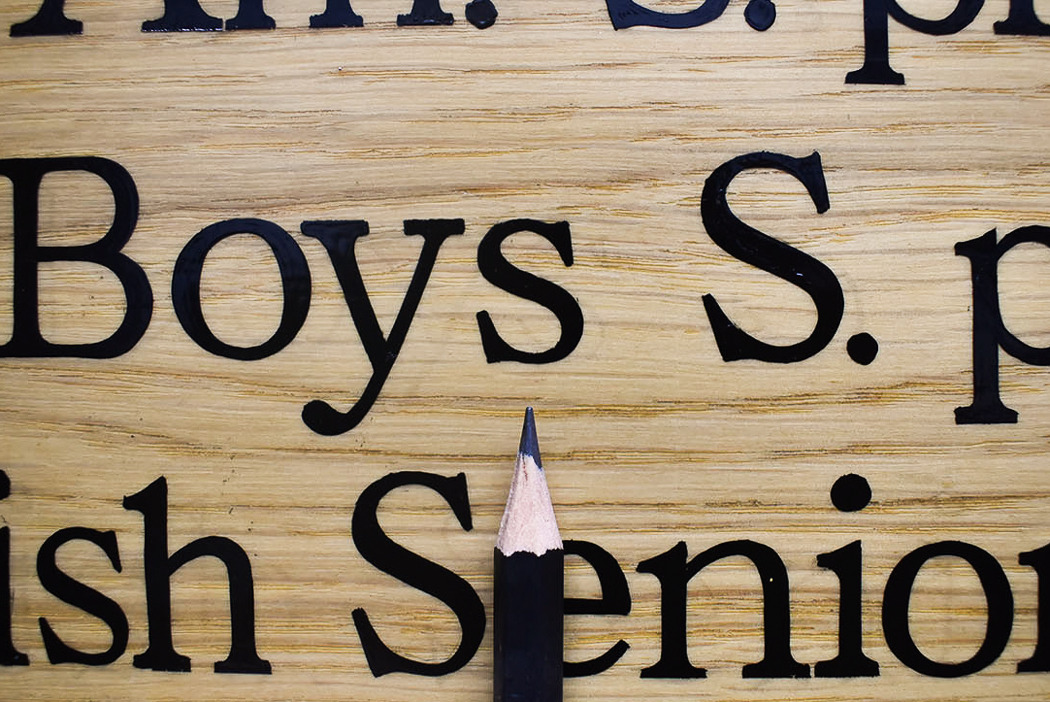 Small hand lettering on honours board