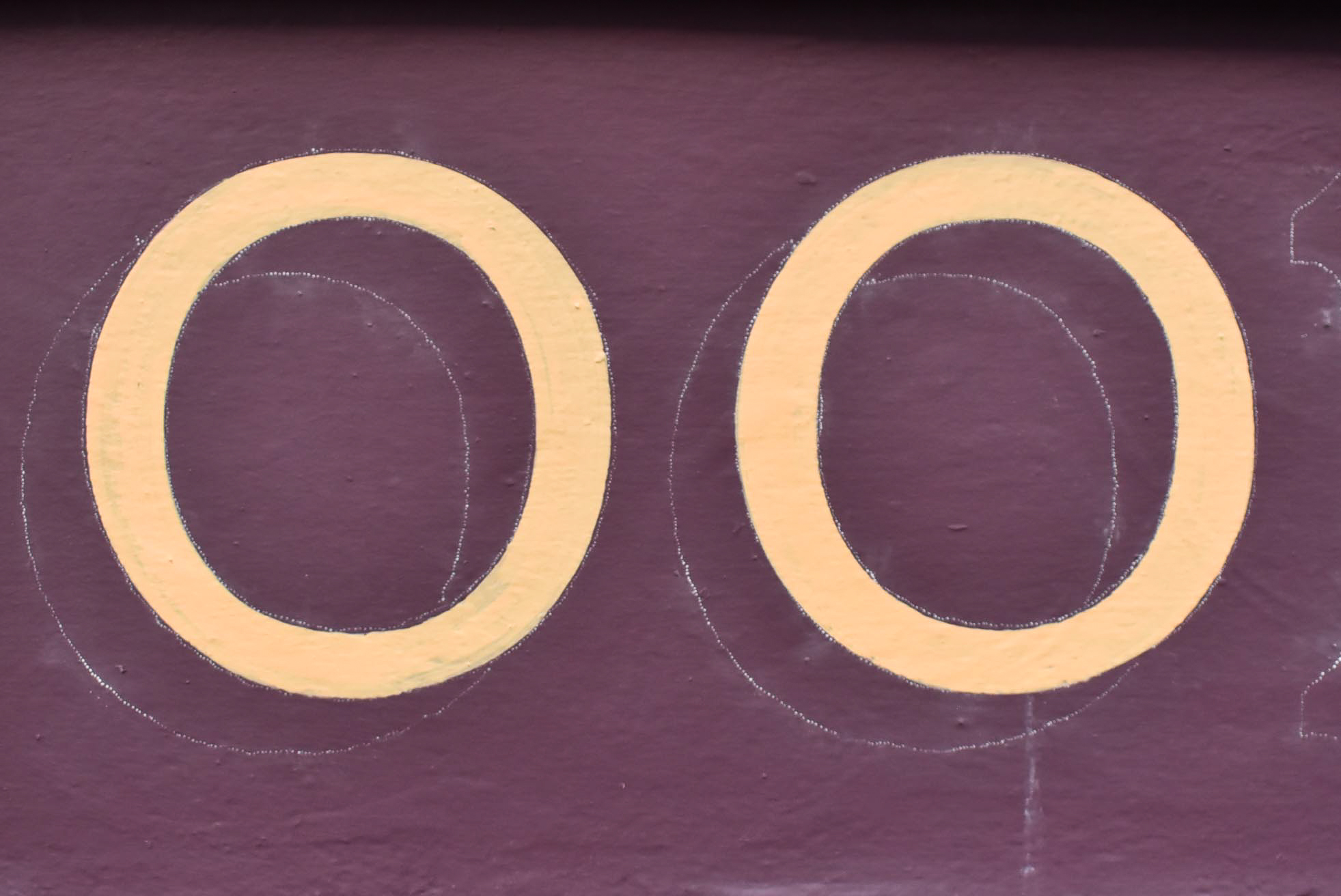 Hand painted double O on a Dundee shop fascia