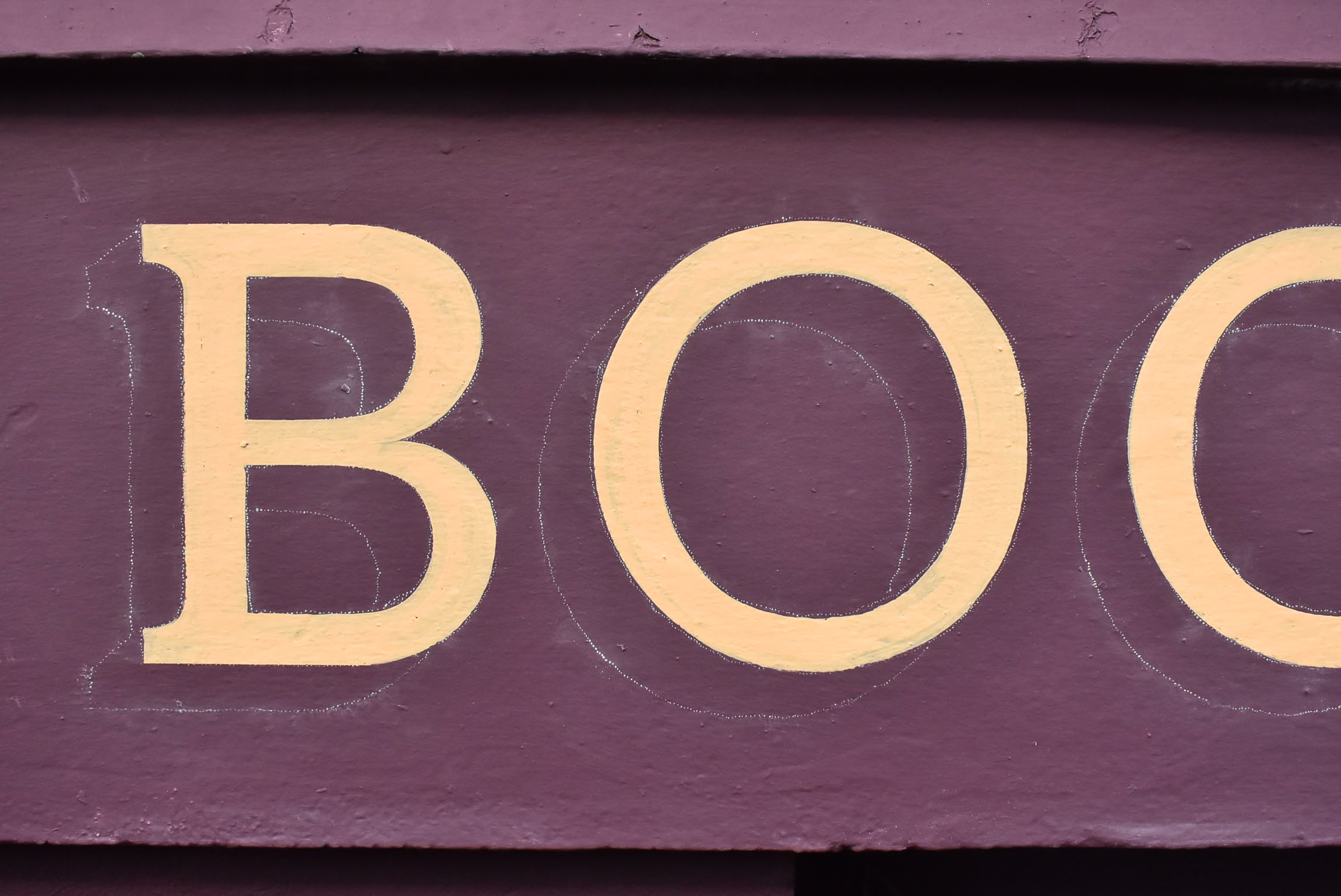 Hand painted lettering process on a Dundee shopfront