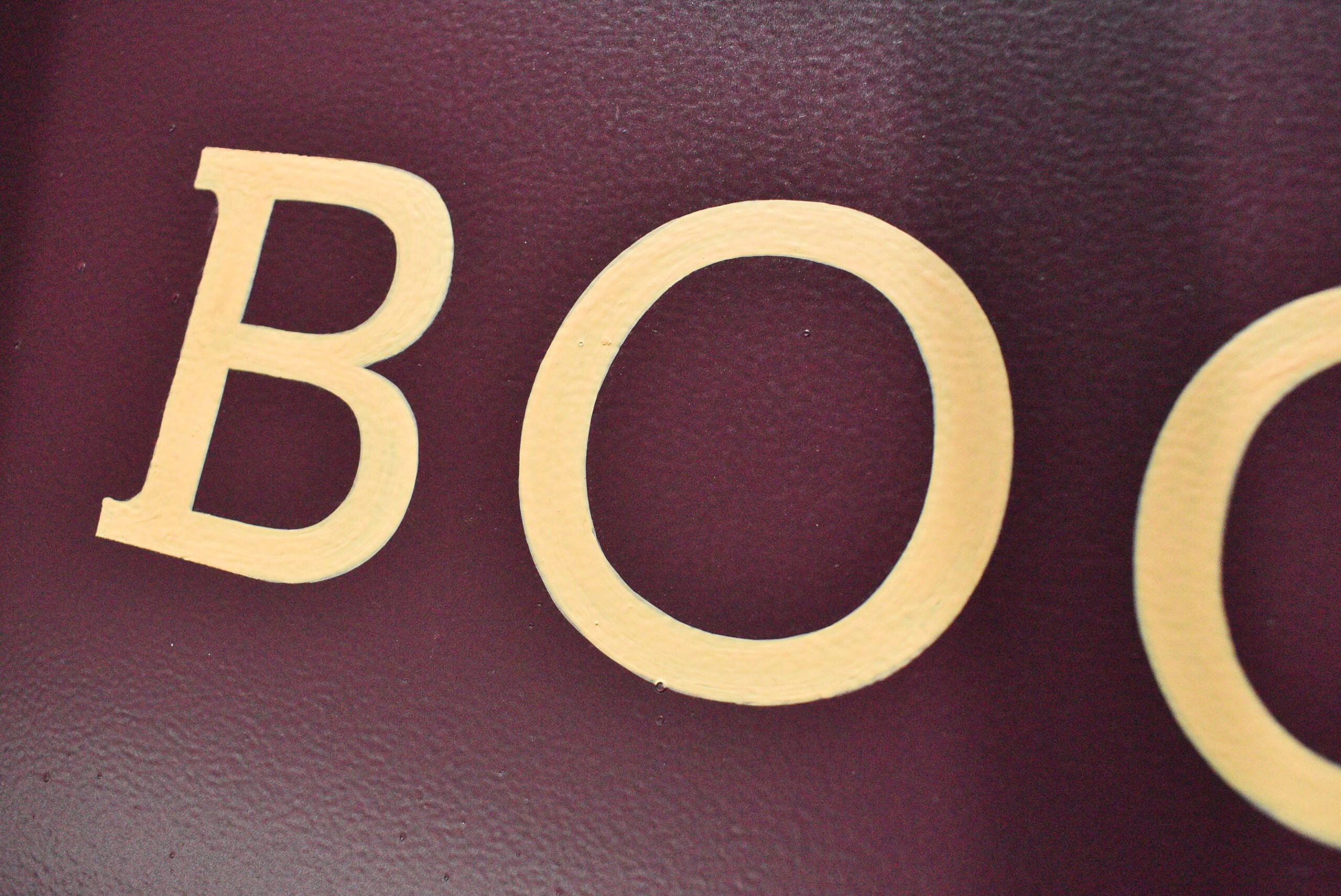 Painted lettering process for a Dundee shop sign