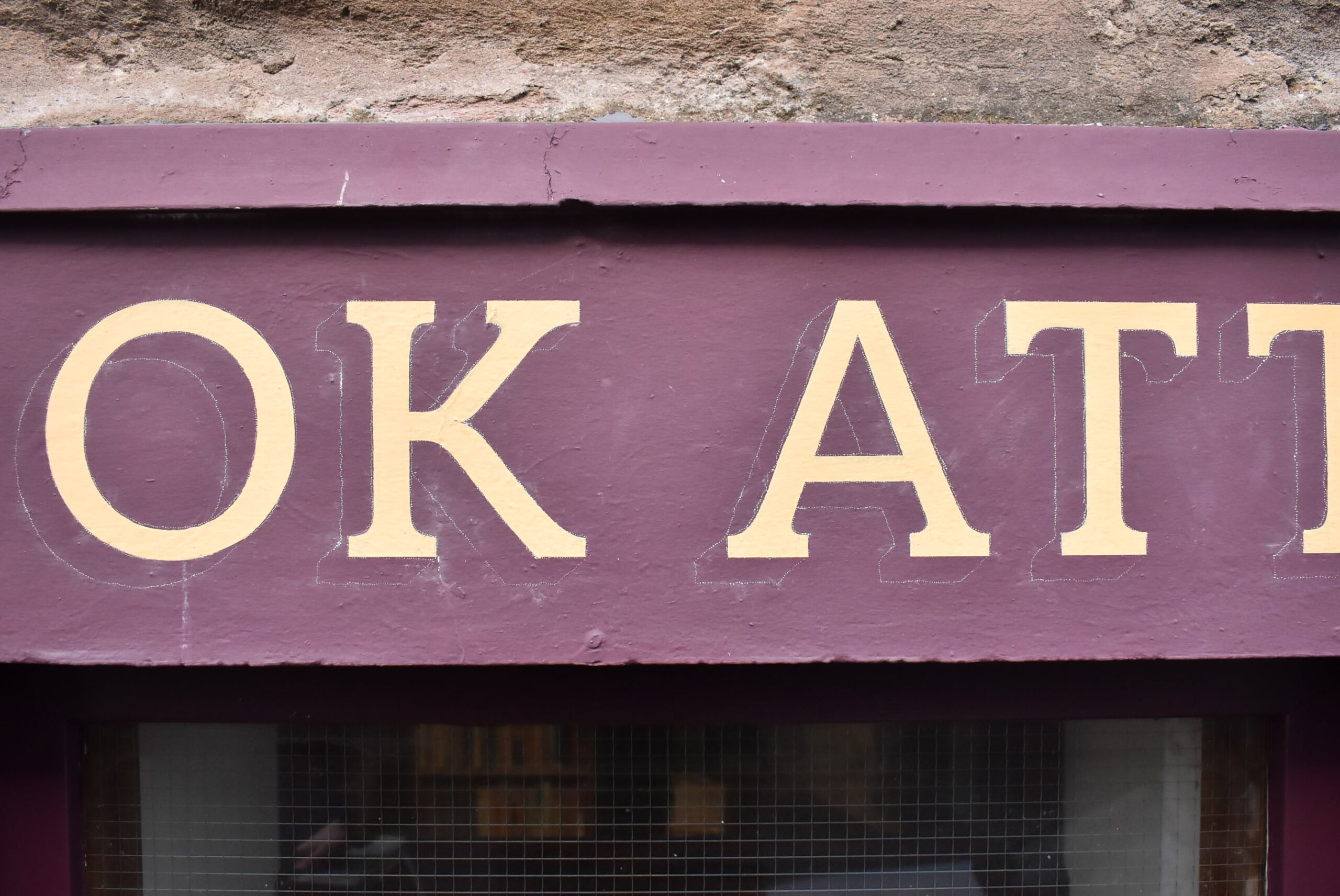 Signwriting a shop fascia on Perth Road Dundee