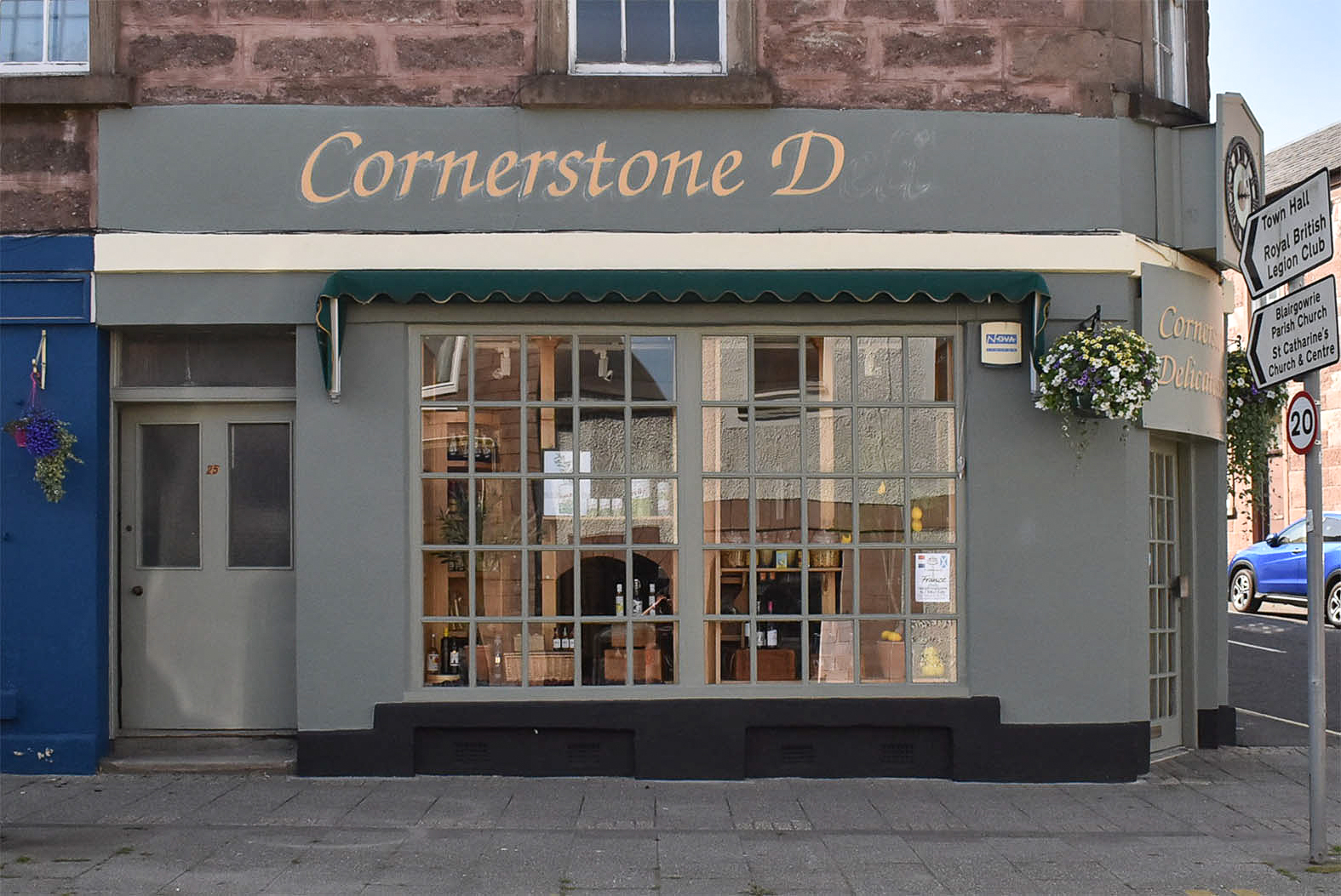 Hand painting shopfronts in Blairgowrie
