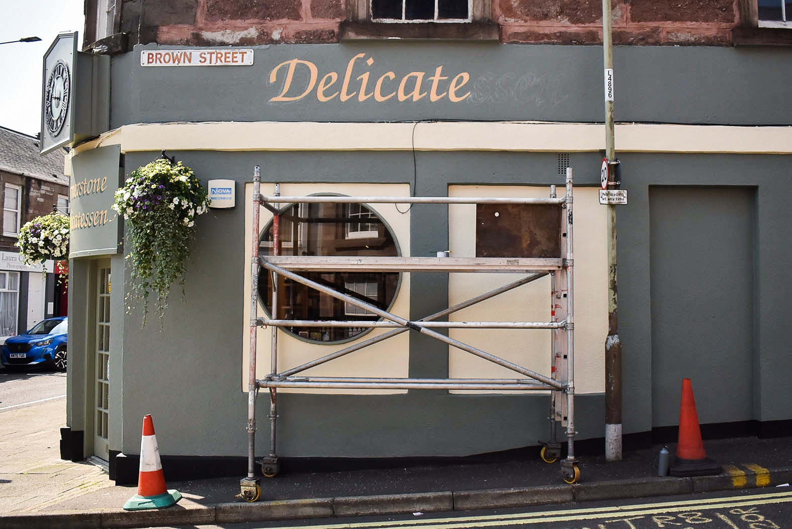 Signwriting a shopfront in Perthshire
